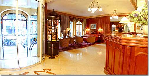 Photo 2 - Hotel Elysees Ceramic Paris 3* star near the Champs Elysees - Go under the sculpted porch and up the steps to the reception where you will find a refined and warm, all marble and wood, setting.
