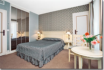 Photo 3 - Hotel de Sevigne Paris 3* star near the Champs Elysees and close to the Arch of Triumph - Non smoking “charm room” with a double bed. Communicating with another room that accomodates 3 persons – private hall that protects the room from the noise of the corridor. 2 large windows, safe, minibar, televisions with 20 channels, large working surface, air conditioned and sound-proof room.
