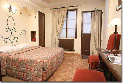 Photo 3 - Hotel Castex Paris 3* star close to Le Marais District and Beaubourg Pompidou Centre - Louis XIII furniture combines with the delicacy of wrought iron against Toile de Jouy wallpaper.