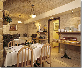 Photo 6 - Hotel California Saint Germain Paris 3* star near the Saint-Germain des Prés District, Left Bank - Have a hearty breakfast in a medieval atmosphere,
and enjoy the soft colors of natural stones and floral arrangements.